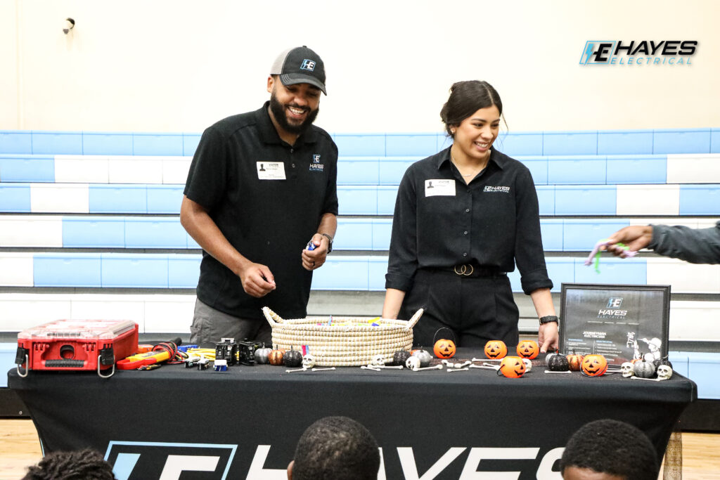 The Hayes Electrical team actively engages with the community, sharing insights and tools at a local event.