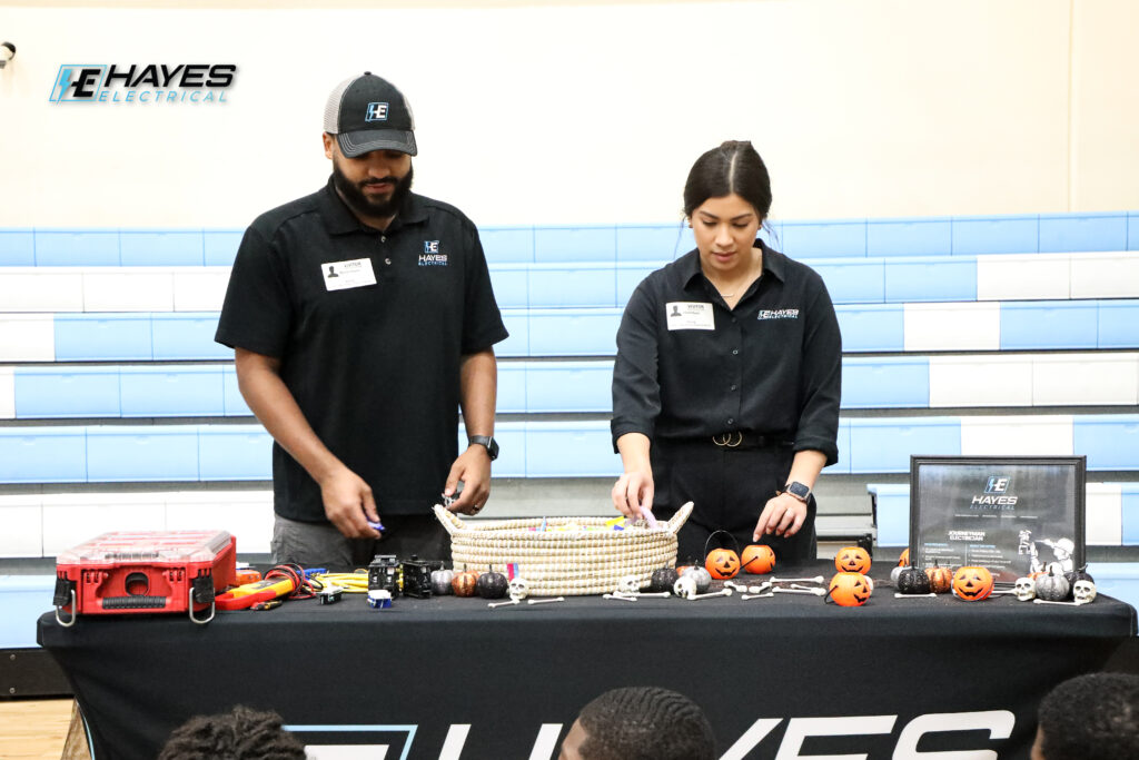 The Hayes Electrical team engages with the community, sharing knowledge and company spirit at a local event.