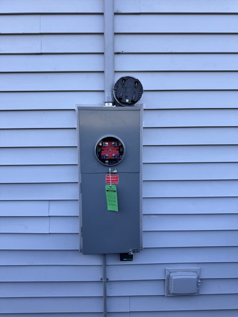Installing a new electrical meter base and emergency disconnect for a safe, reliable power supply.