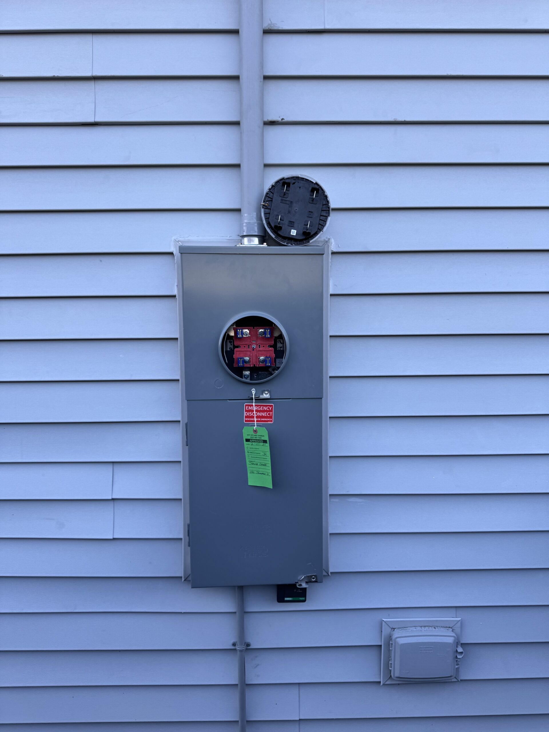 Installing a new electrical meter base and emergency disconnect for a safe, reliable power supply.