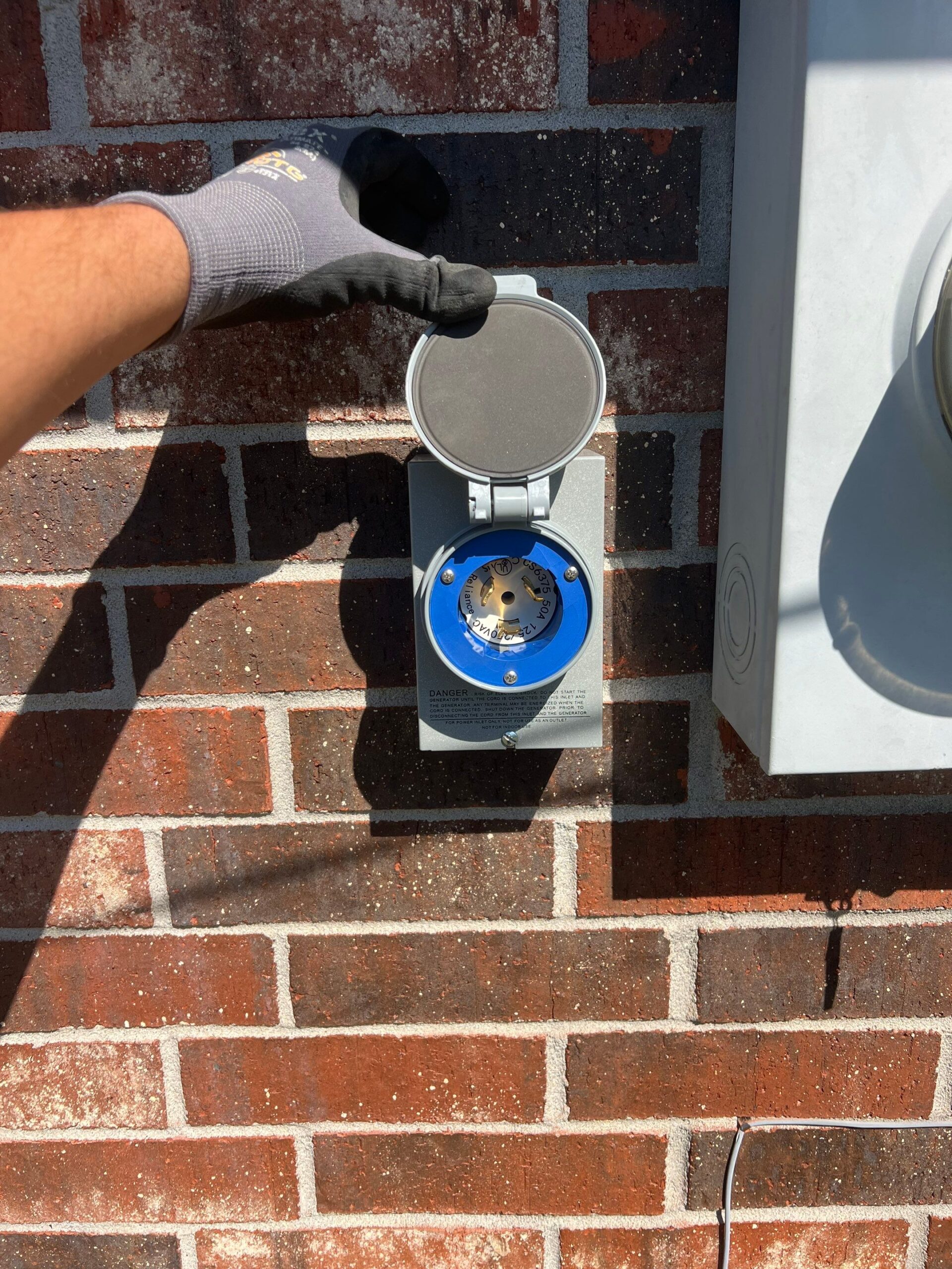 Installing a reliable generator power inlet for backup power at a Lake Charles home.