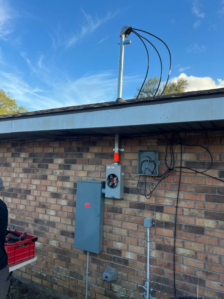 Upgrading a residential electrical service entrance with a new meter base and main disconnect panel.