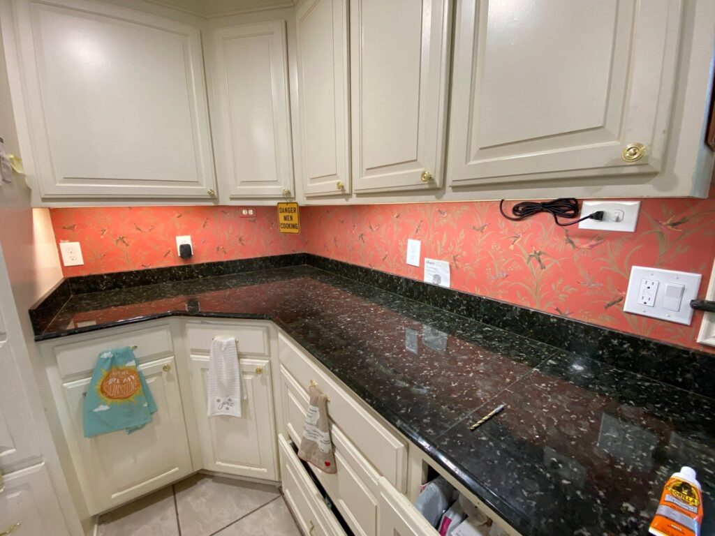 Installing new electrical outlets and switches to enhance functionality and safety in a modern kitchen.